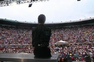 Nick speaking at a stadium in Colombia-small